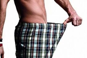 The man looks at the penis and wants to enlarge him
